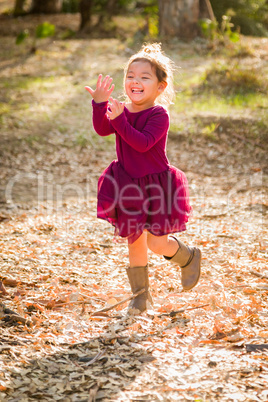 Cute Young Mixed Race Baby Girl Playing Outdoors