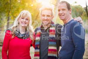 Loving Middle Aged Parents and Young Son Portrait Outdoors