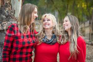 Beautiful Mother and Young Adult Daughters Portrait Outdoors