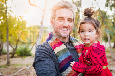 Handsome Caucasian Young Man with Mixed Race Baby Girl Outdoors