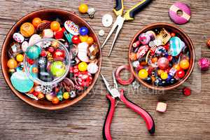 Colorful beads on a wooden surface