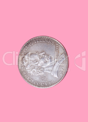 half dollar coin isolated on pink background