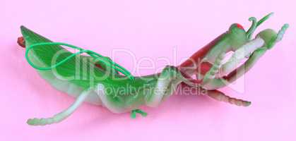 mantis toy on pink background at day