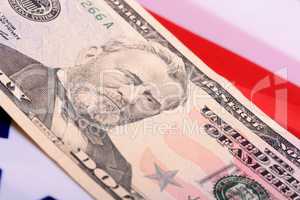 fifty dollar bill in front of the American flag