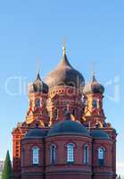 Orthodox assumption Cathedral of red brick. Winter Sunny day, blue sky in the background. Russia, Tula