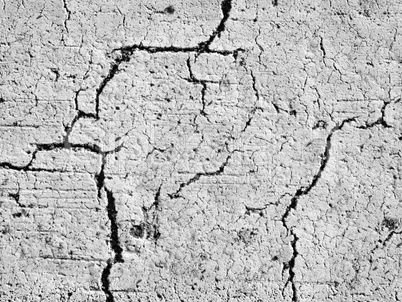 textures of old wall surface painted with white paint and covered with cracks
