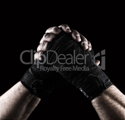 gesture of friendship, two male hands of an athlete tied with a