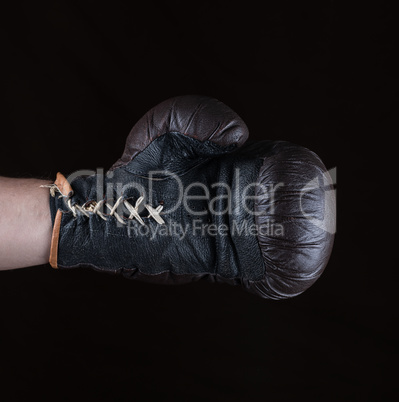 brown boxing glove dressed on man's hand