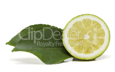 Half lemon fruit with two leaves on the side