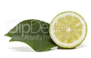 Half lemon fruit with two leaves on the side