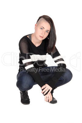 Lovely woman crouching on the floor