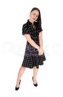 Beautiful woman standing in an pock dot dress