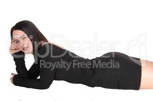 Slim young woman lying on stomach on floor
