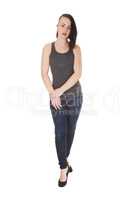 Pretty young woman standing in jeans
