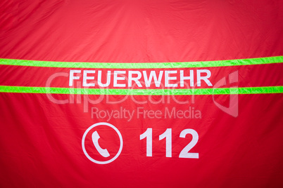 German fire department logo on a tent. The german word Feuerwehr means fire department.