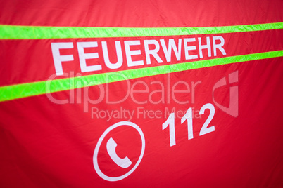 German fire department logo on a tent. The german word Feuerwehr means fire department.