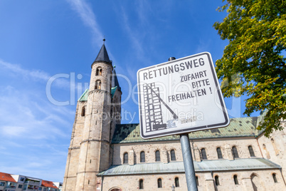 German escape route sign near a church. Rettungsweg, Zufahrt freihalten means escape route, keep clear the driveway