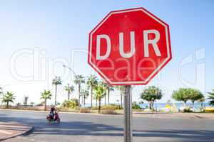 Turkish Stop sign on a street near the beach. DUR is the turkish word for stop.