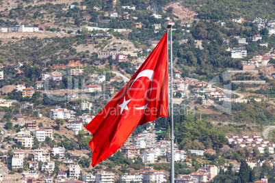 Turkish flag in front of the city of Antalya