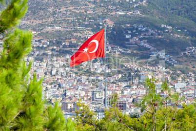 Turkish flag in front of the city of Antalya