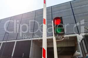 Barrier with a red traffic light at a car park