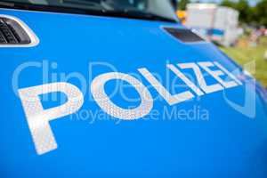 Polizei sign on a german police car. Polizei is the german word for police department.