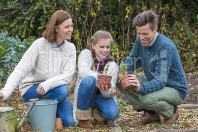 Happy Family Girl Child Father Mother Daughter Gardening