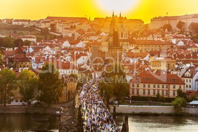 Tourists on Charles Bridge at sunset, Prague, Czech Republic