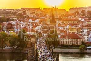 Tourists on Charles Bridge at sunset, Prague, Czech Republic