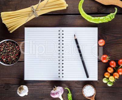 blank notebook with white sheets, raw long paste and ingredients