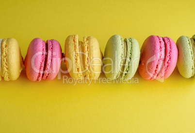 dessert macarons lies in a row in the middle