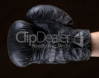 hand in black leather boxing glove