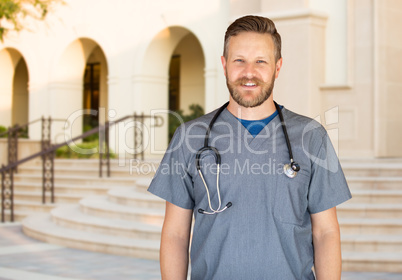 Caucasian Male Nurse In Front Of Hospital Building