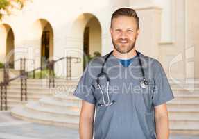 Caucasian Male Nurse In Front Of Hospital Building