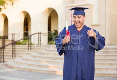 Hispanic Male With Deploma Wearing Graduation Cap and Gown