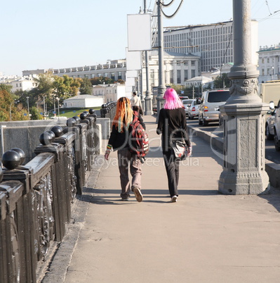 girl and boy  on bridge with creative hairstyle