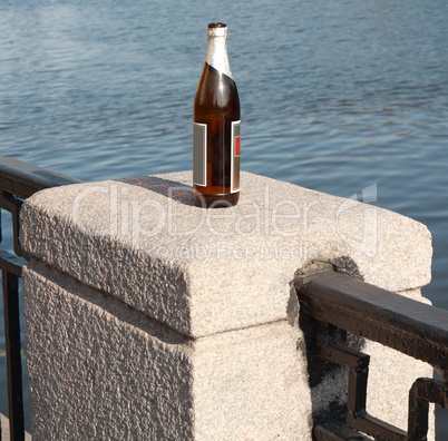 bottle on fence