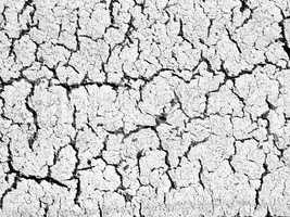 textures of old wall surface painted with white paint and covered with cracks