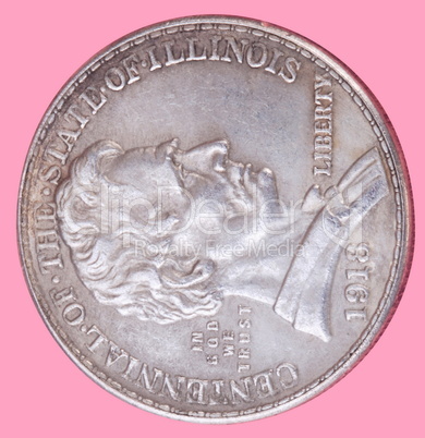 half dollar coin isolated on pink background