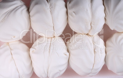 many white marshmallow on pink background at dry day