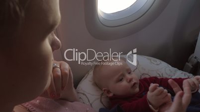 Mother and her baby chilling on airplane