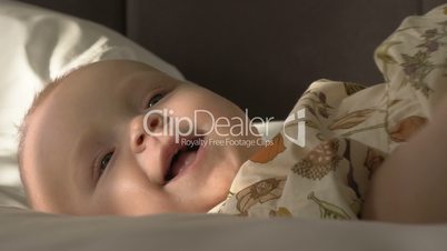 Indoor portrait of happy six months old baby girl