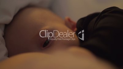 A cute closeup of a breastfeeding scene