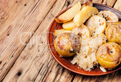 Baked potatoes, apples and sauerkraut.