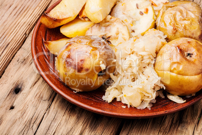 Baked potatoes, apples and sauerkraut.