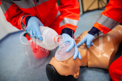 German paramedic trains emergency basics on a puppet