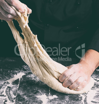 male hands substitute white wheat flour dough