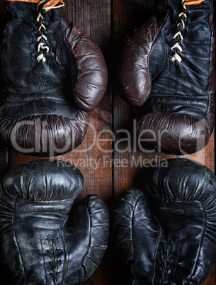 two pairs of leather old boxing gloves