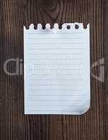 empty notepad paper attached with a button