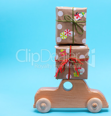 wooden children's machine carries gifts wrapped in paper